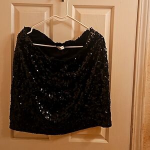 A black sequence skirt. Name brand MANER XXL